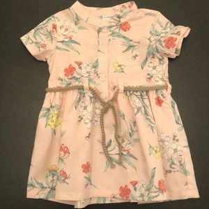 Unique baby girl dress with tie waist.